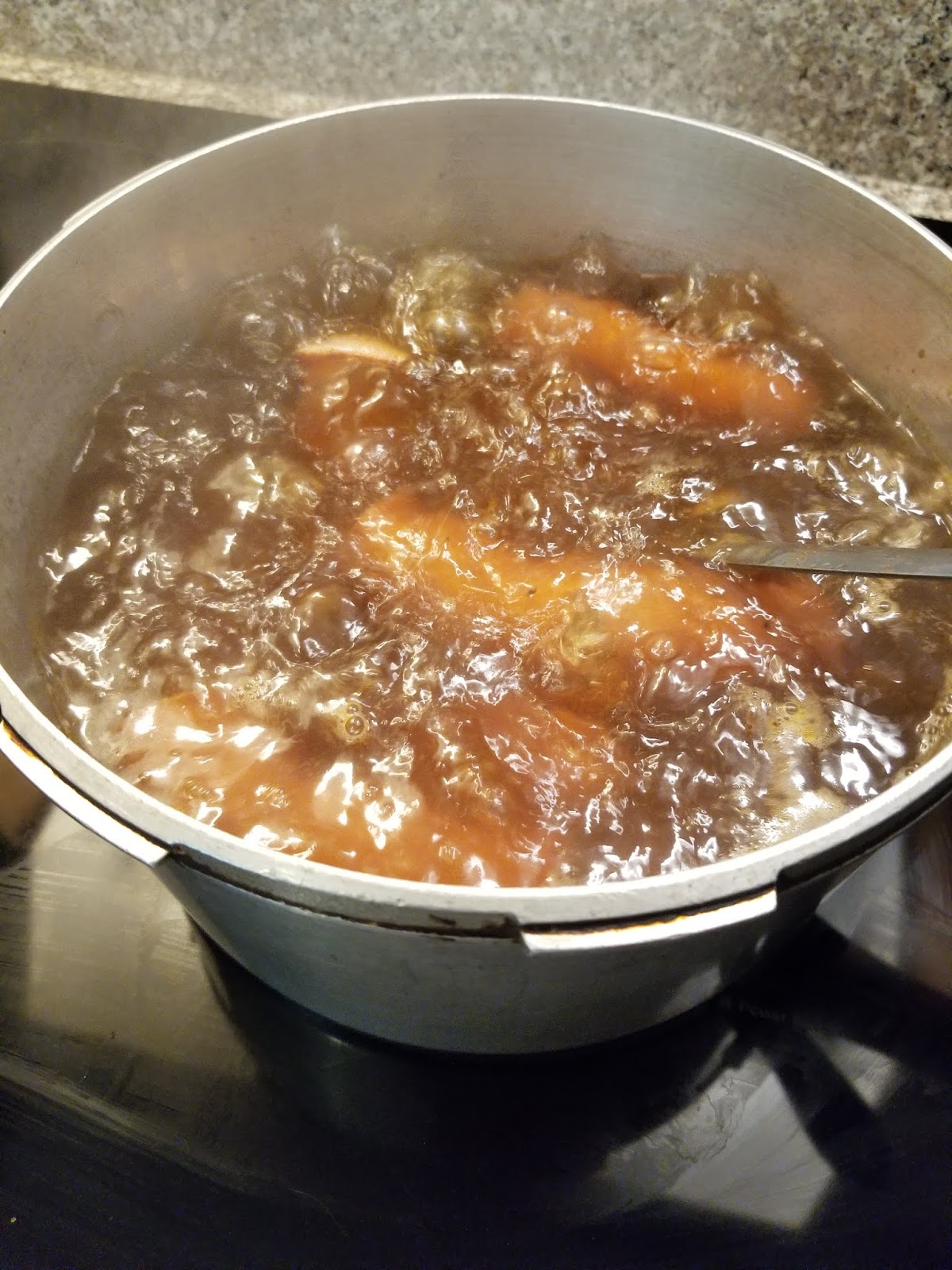 Boiling pot as sausage simmers